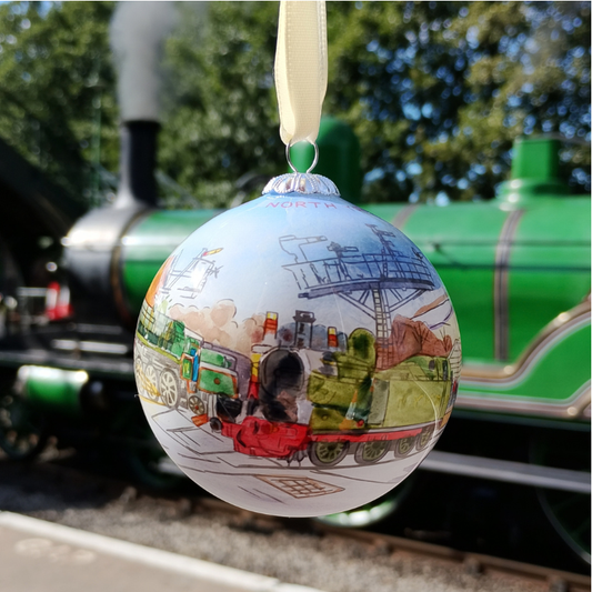 A hand painted glass bauble showing the other side of the design with Little 29 beneath the signals at Grosmont.