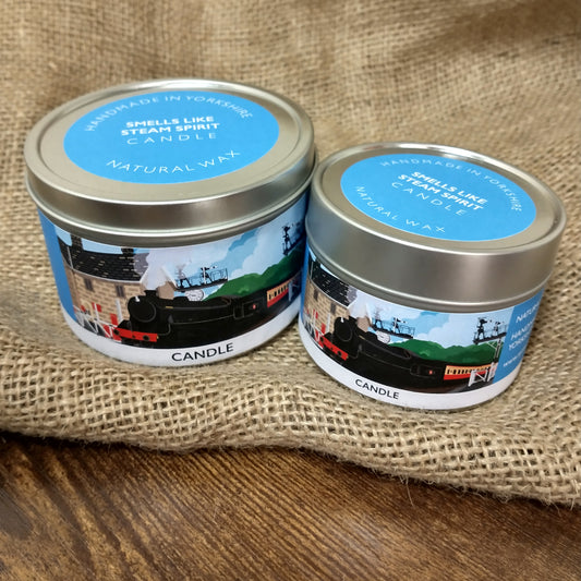 Two different sized tins with lids that are labelled up as candles.