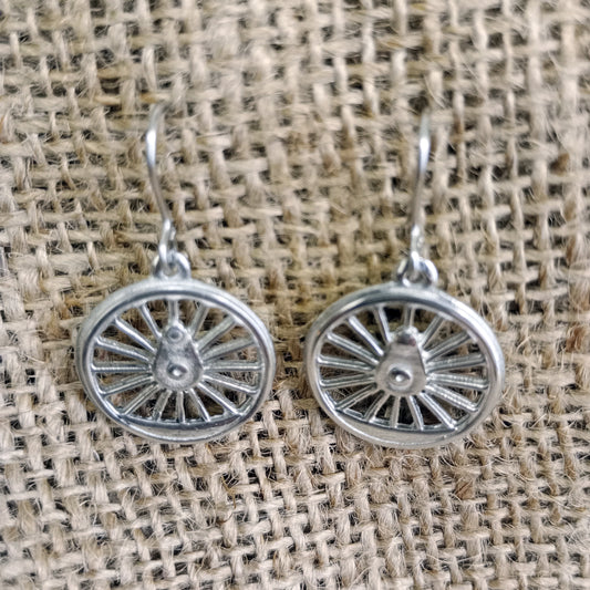 A close up shot of the earrings showing the raised relief.