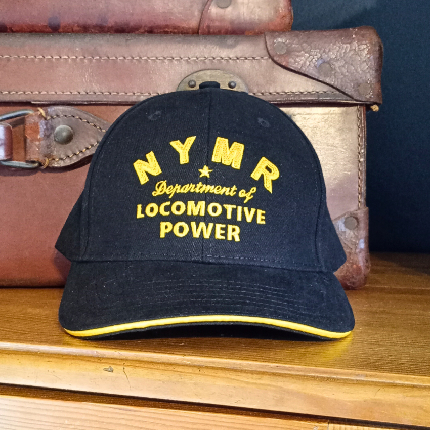 Black baseball cap with N Y M R Department of Locomotive Power embroidered in front.