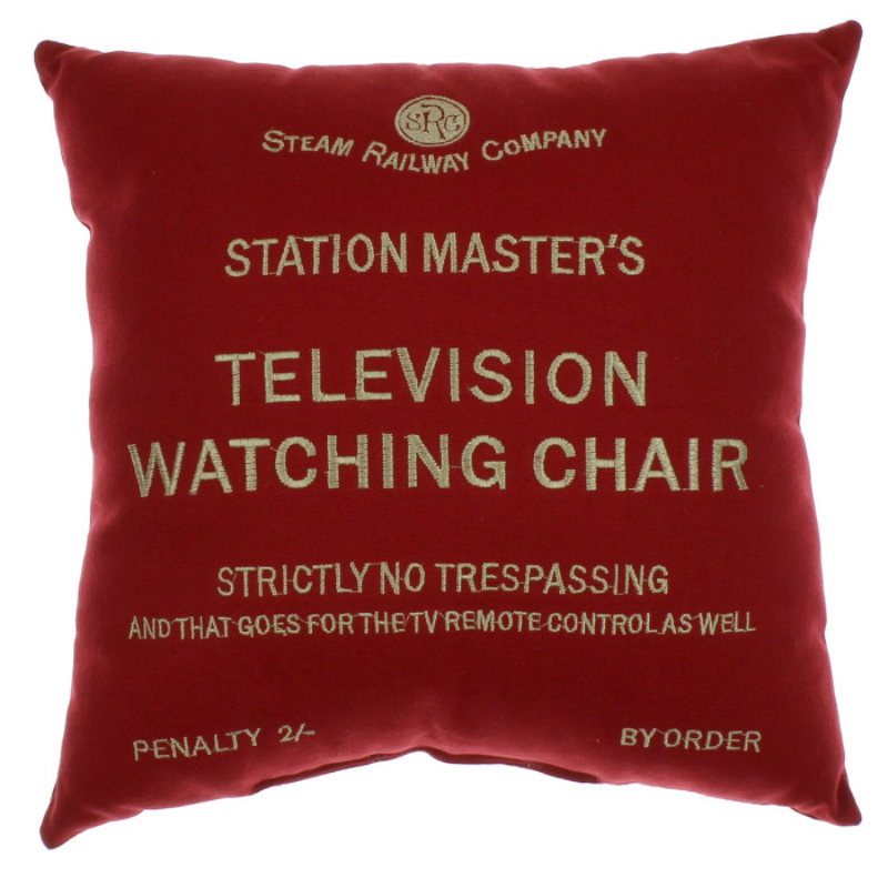 A red cushion with embroidered design on - Station Master's Television Watching Chair