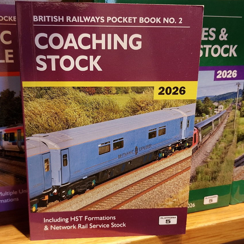 Book titled 'Coaching Stock' by British Railways on a wooden surface
