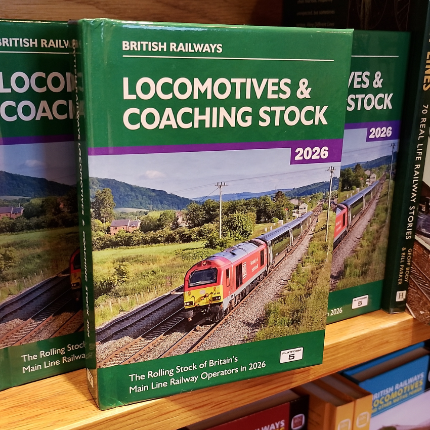 Book titled 'Locomotives & Coaching Stock' by British Railways on a shelf.