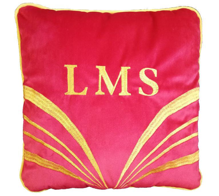 Square red cushion with L M S initials and a curved stripe design embroidered in gold