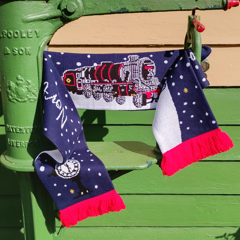 The scarf on its own, folded to show both front design and the reverse.