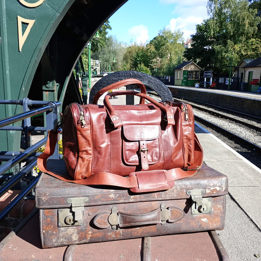 A large leather holdall sat on an old fashioned station trolley on Pickering Station.