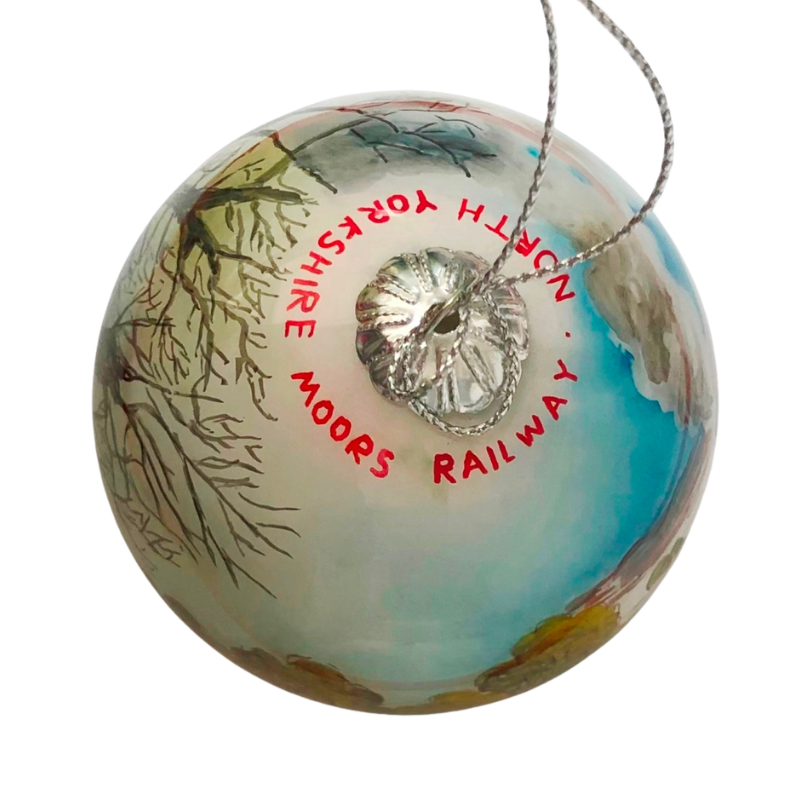 Bauble top view showing the writing NORTH YORKSHIRE MOORS RAILWAY around the top in red hand painted lettering.