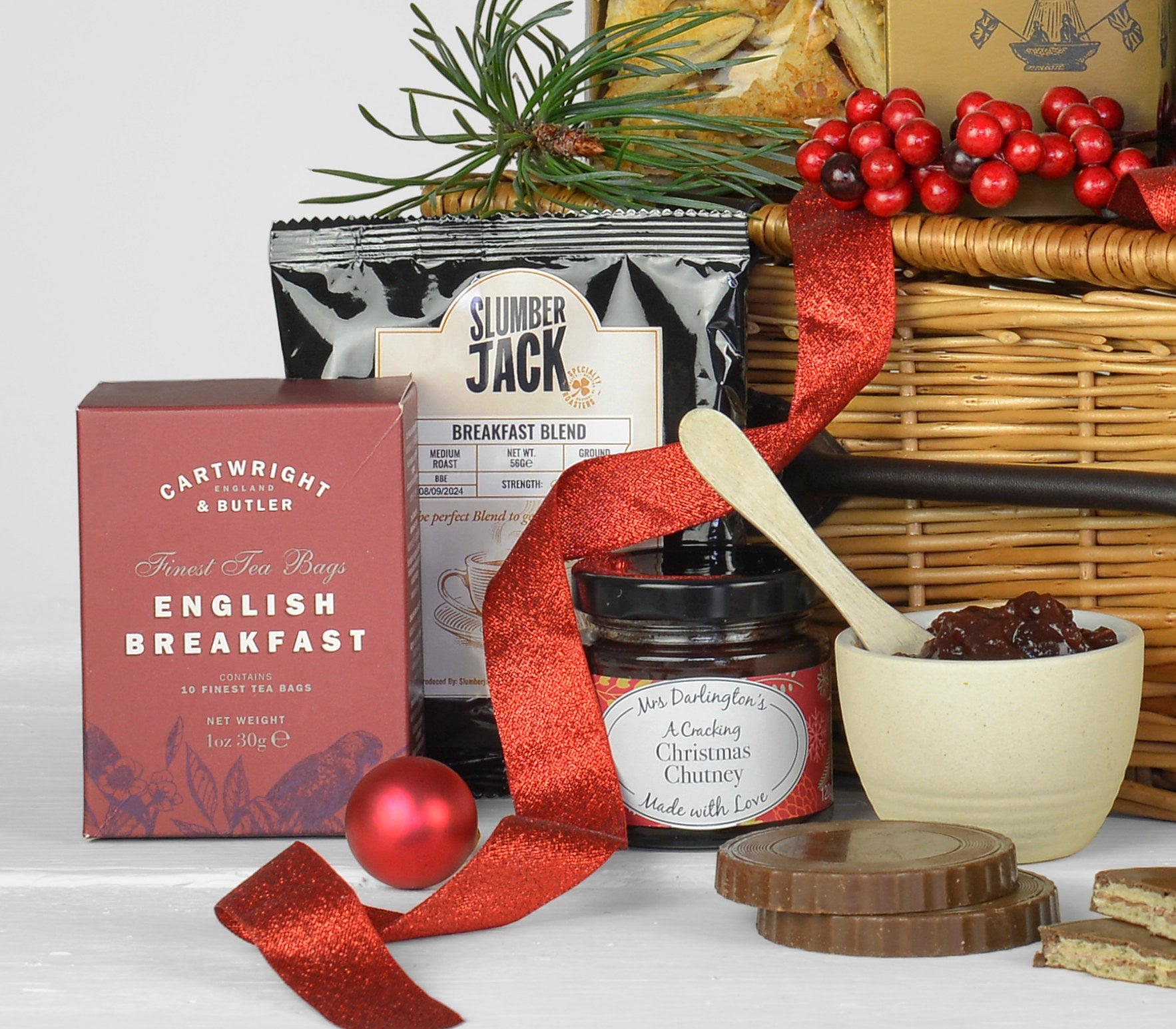 Gift basket with English breakfast tea, Slumber Jack coffee, Christmas chutney, and chocolate wafer rounds.