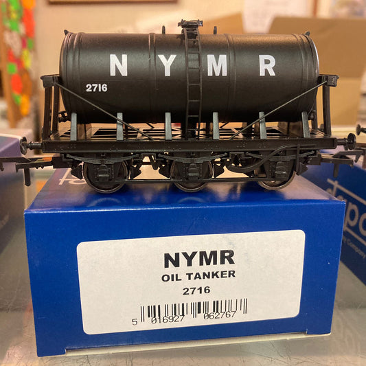 a black model railway oil tanker with white NYMR lettering.