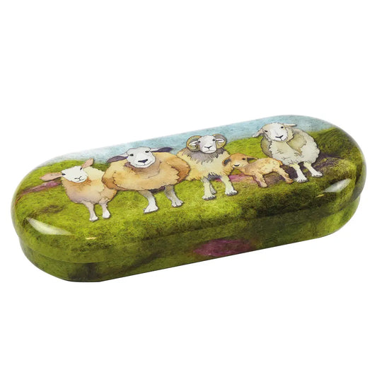 Curved shiny metal tin with the felted sheep design printed on the outside.