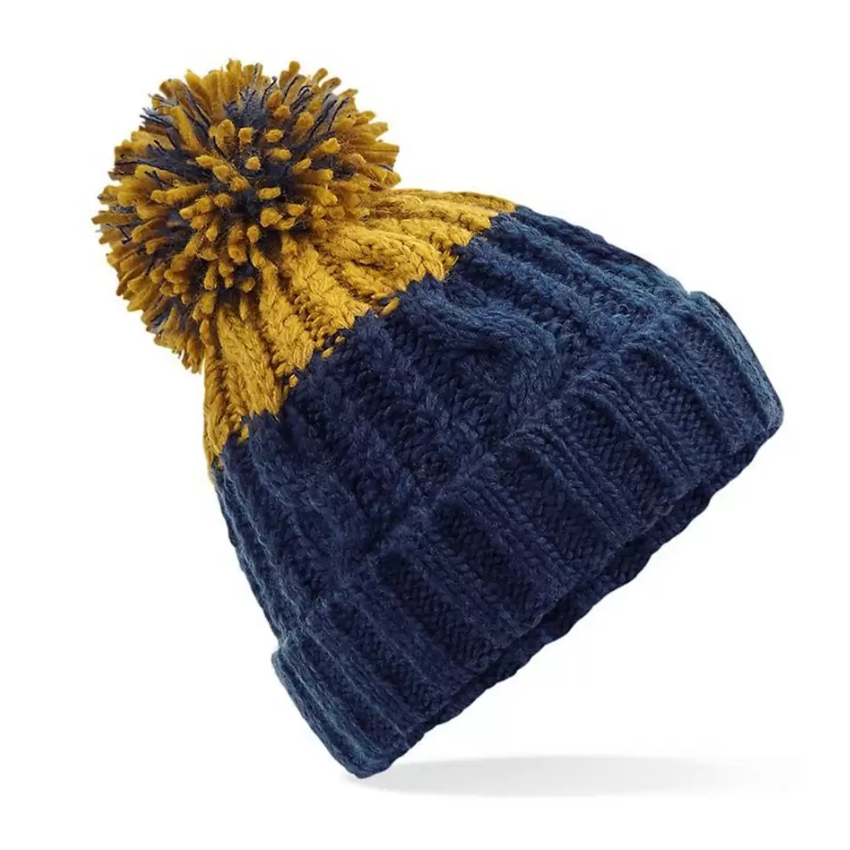 Blue and mustard yellow beanie with pom-pom on a white background
