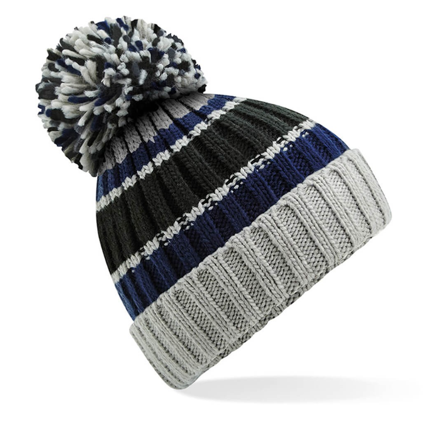 Knitted beanie with striped pattern and pom-pom on a white background