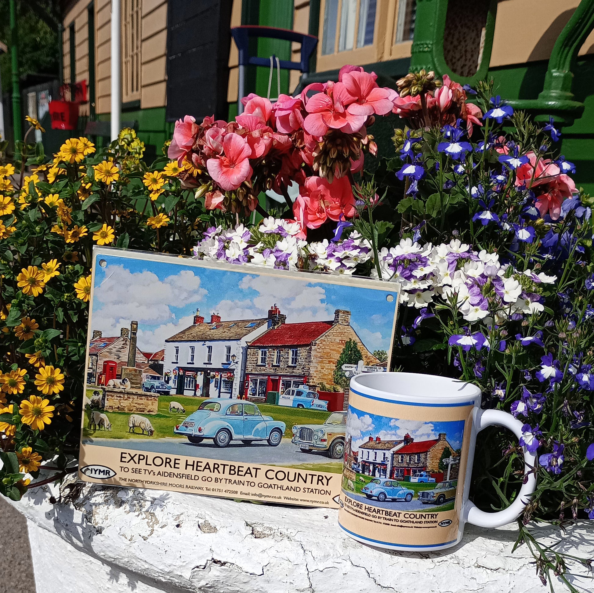 A picture of the sign alongside the matching mug.