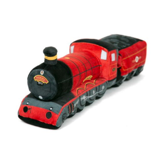 A soft looking red train shaped cushion.