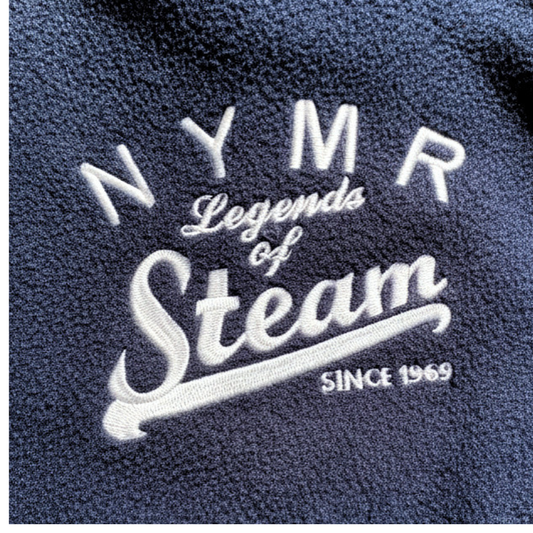 Close-up of embroidered text on a fleece fabric background