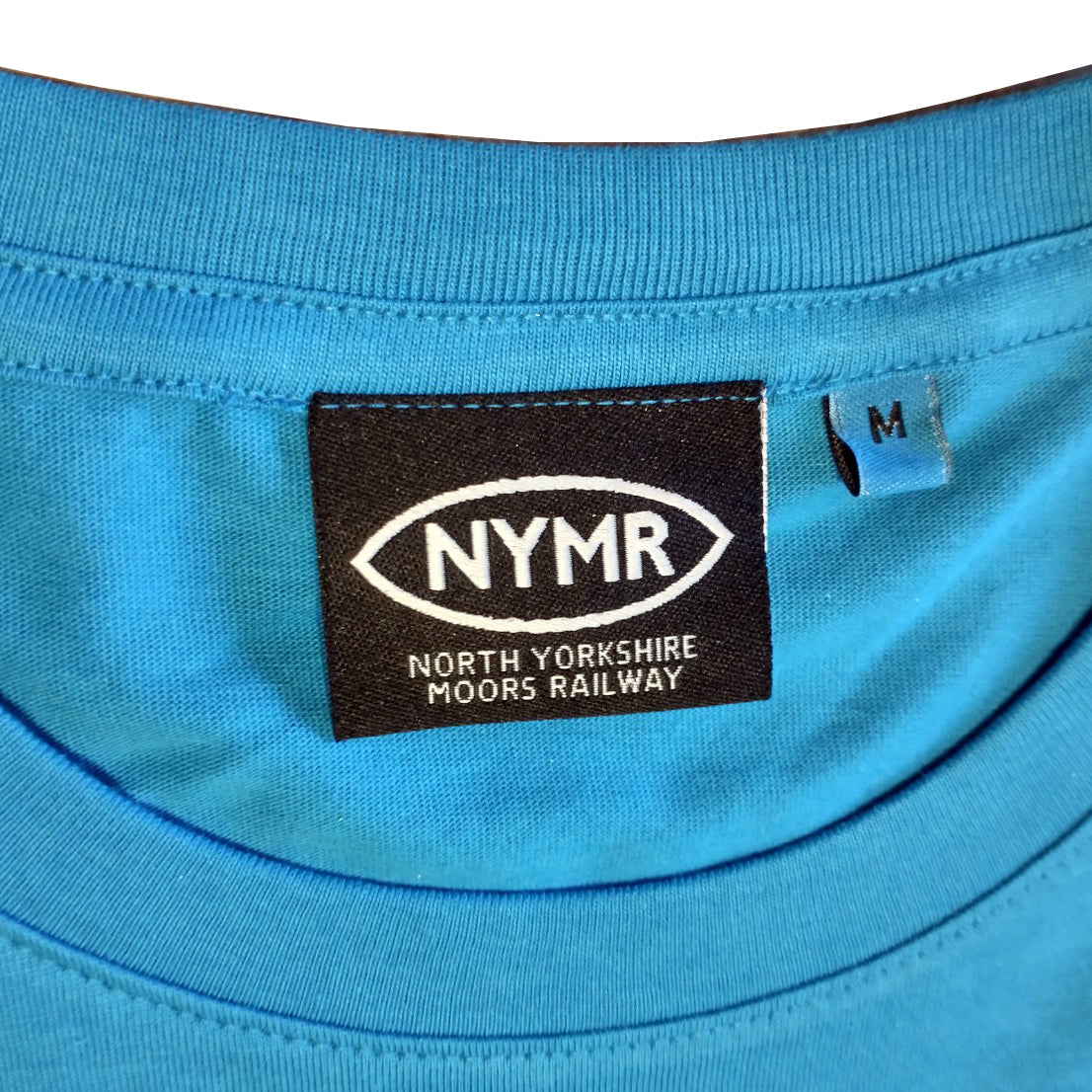 A close up shot of the NYMR logo neck label