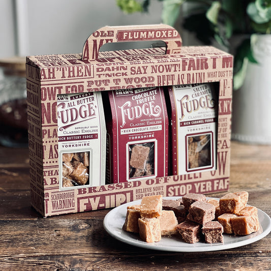Three boxes of Lottie Shaws fudge in a traditional style cardboard window box with carrying handle.