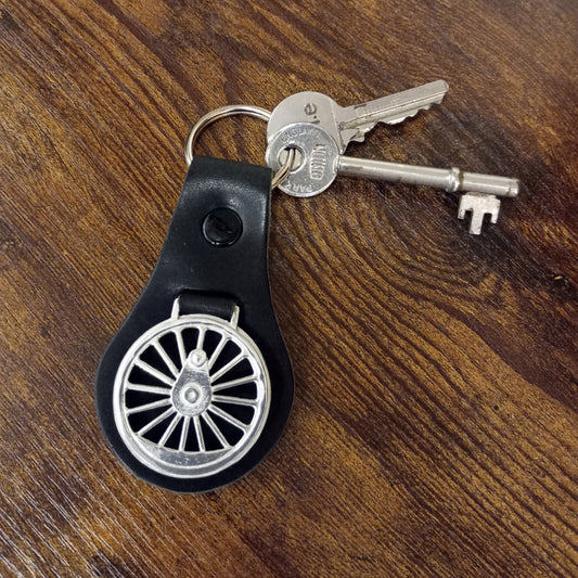 A close up of the key fob with keys attached