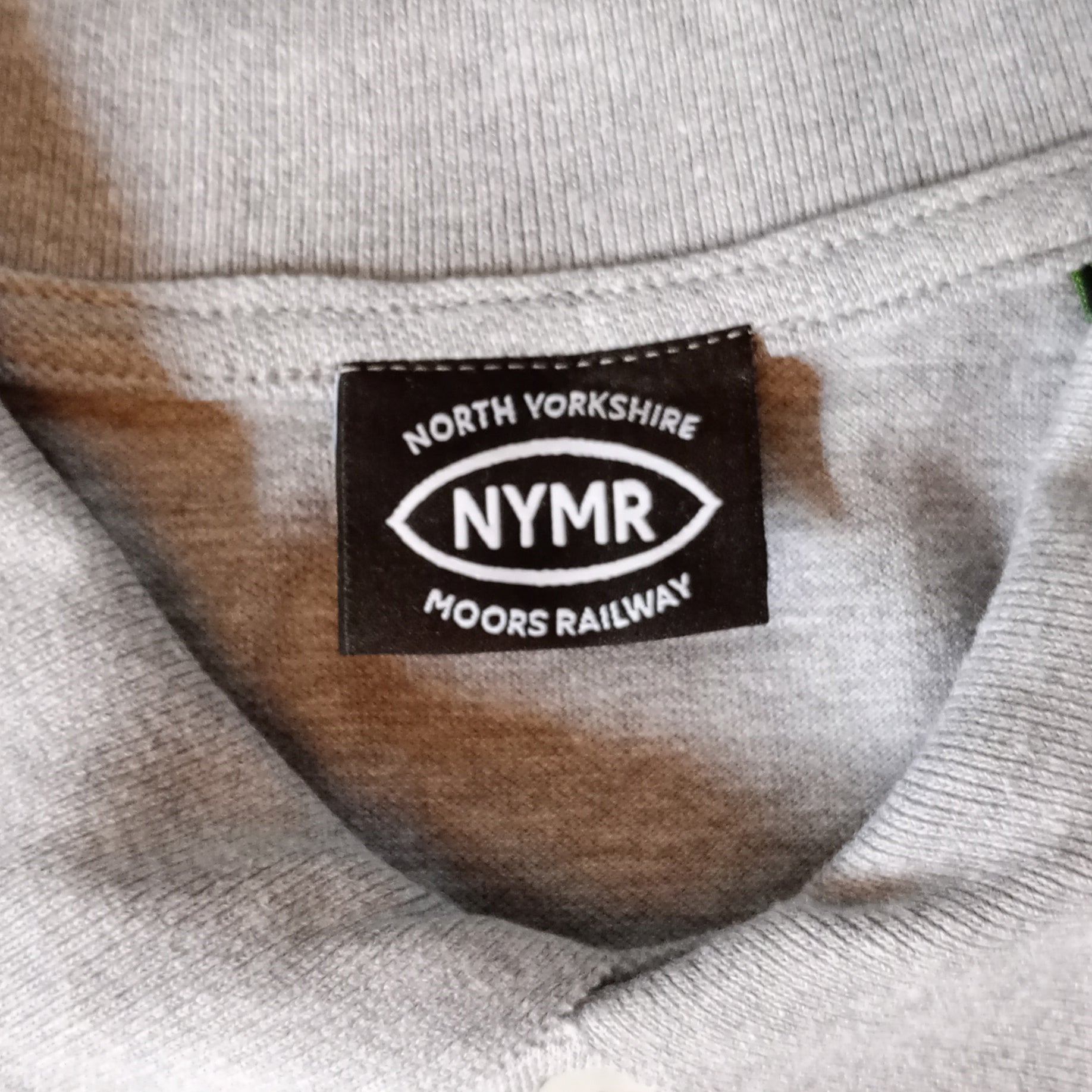 Close up of NYMR logo on neck label