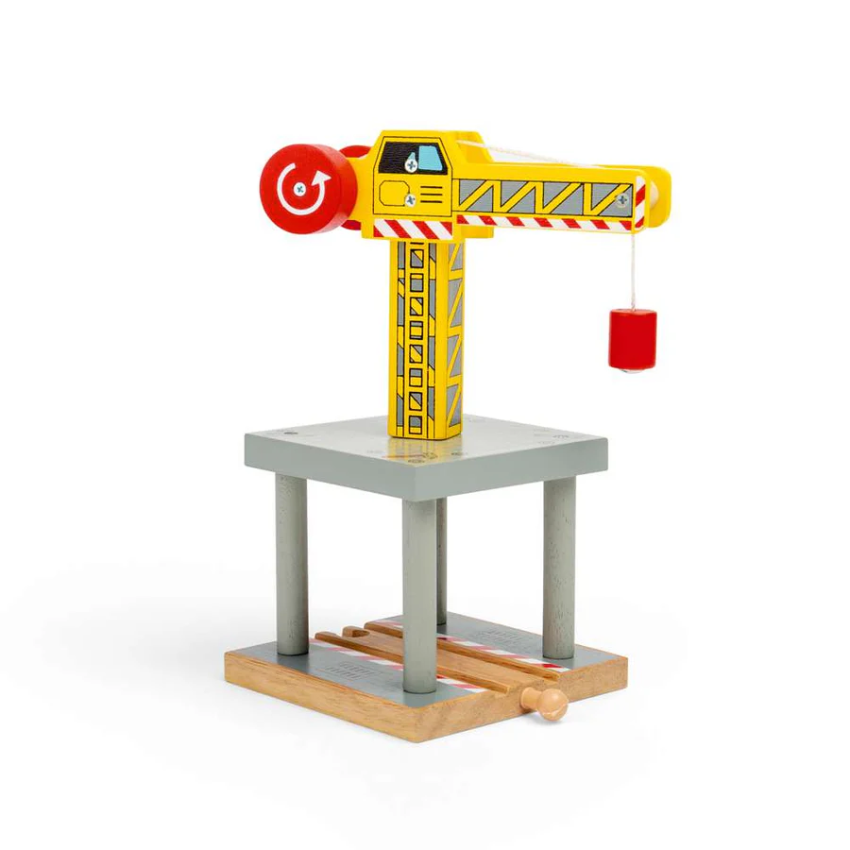 A wooden toy crane with moveable parts, painted in yellow on a grey platform