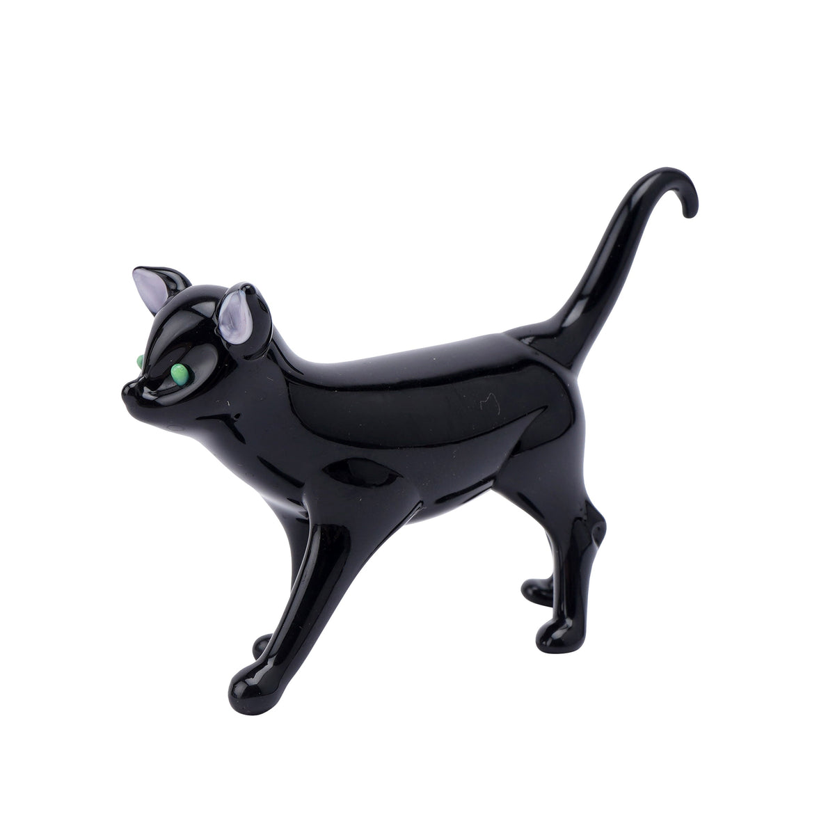a glass ornament of a black cat with tail high and curved and green eyes.