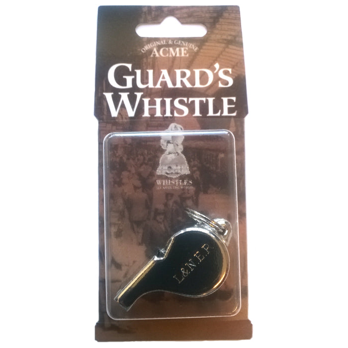 Metal Acme guard's whistle in blister pack with L & N E R engraved on it