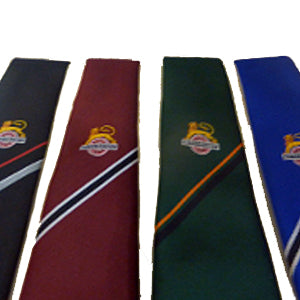 Four British Railways ties in black, maroon, green and blue with gold lion and wheel emblem and diagonal stripe