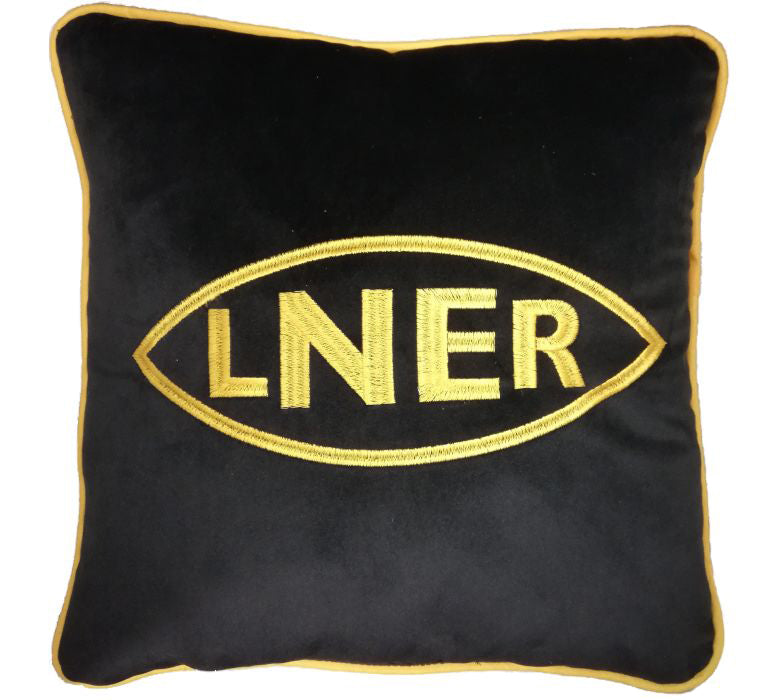Black square cushion with gold piping and the L N E R logo embroidered in gold