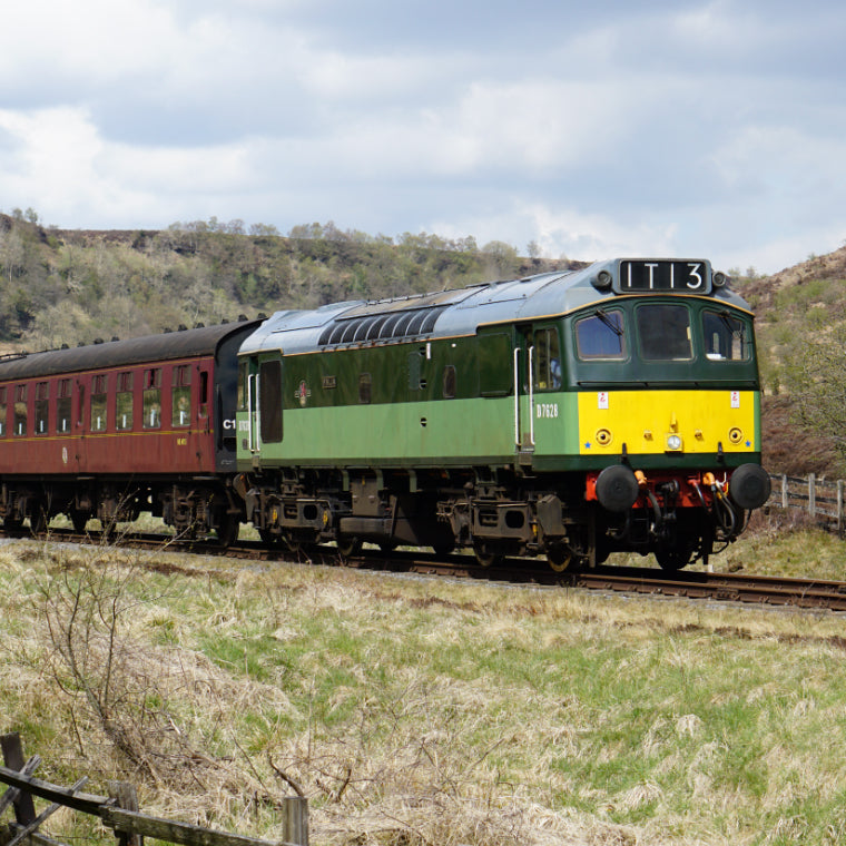 Diesel D7628 pulling carriages through along the North Yorkshire Moors Railway
