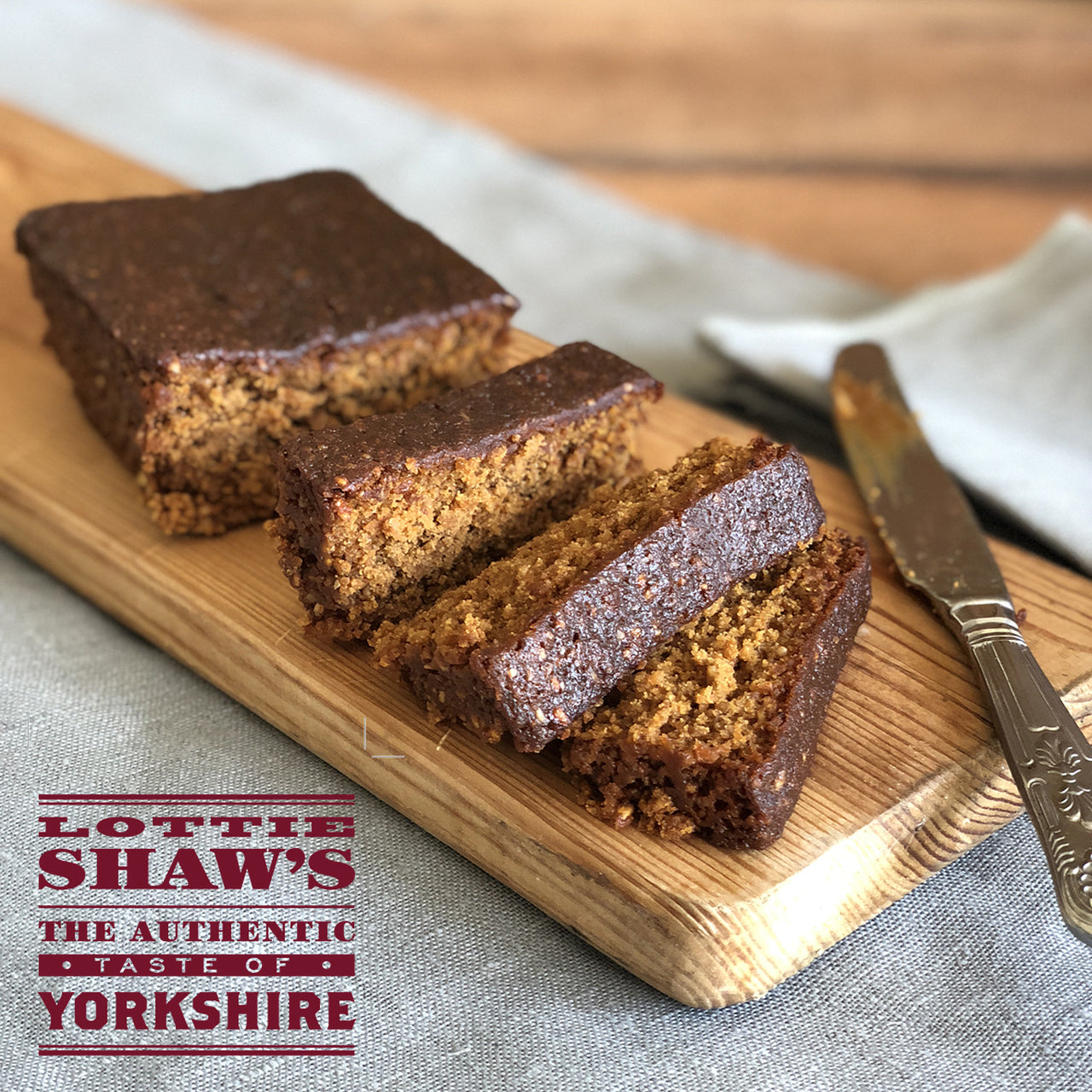 Lottie Shaw's seriously good parkin shown sliced on a cutting board.