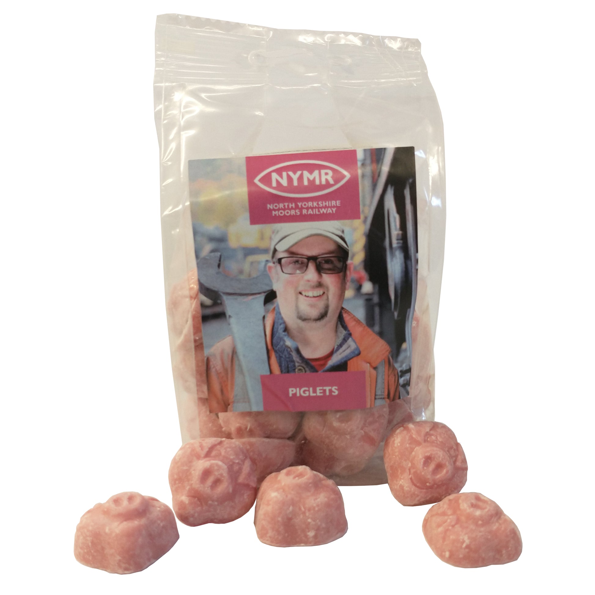Packet of Piglets with photo of Piglet with an enormous spanner on the front and some of the candies which are shaped like pigs' faces.